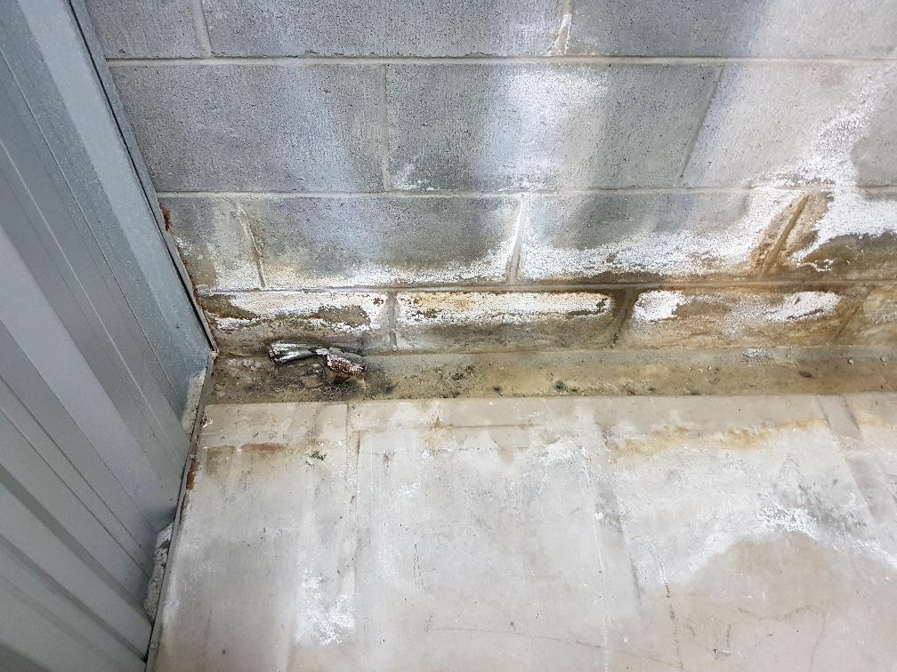Efflorescence caused by water leak in self storage facility 