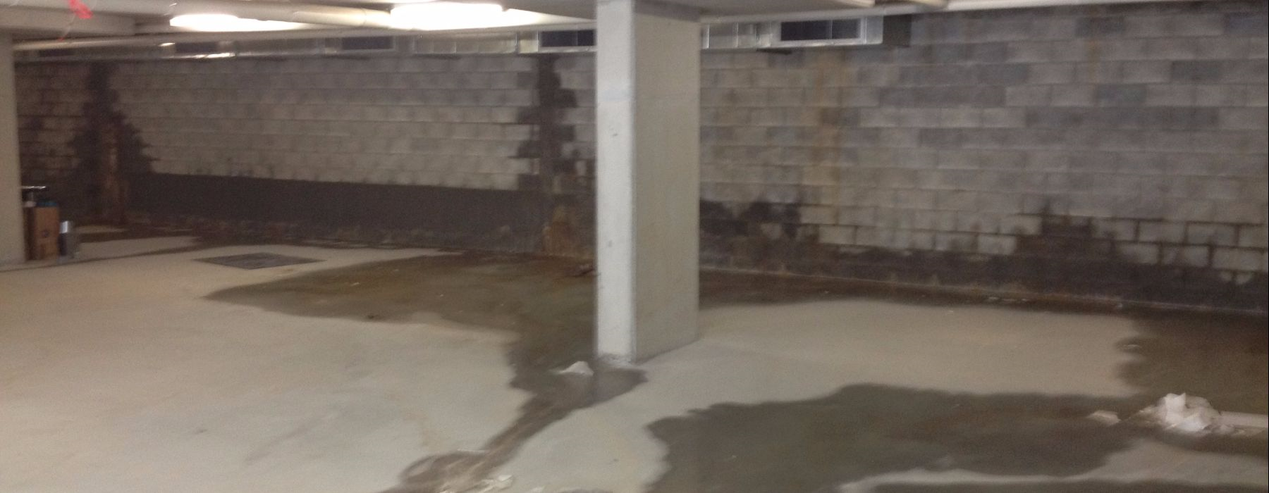 Leaking damp wall - rising damp - water ingress - garage