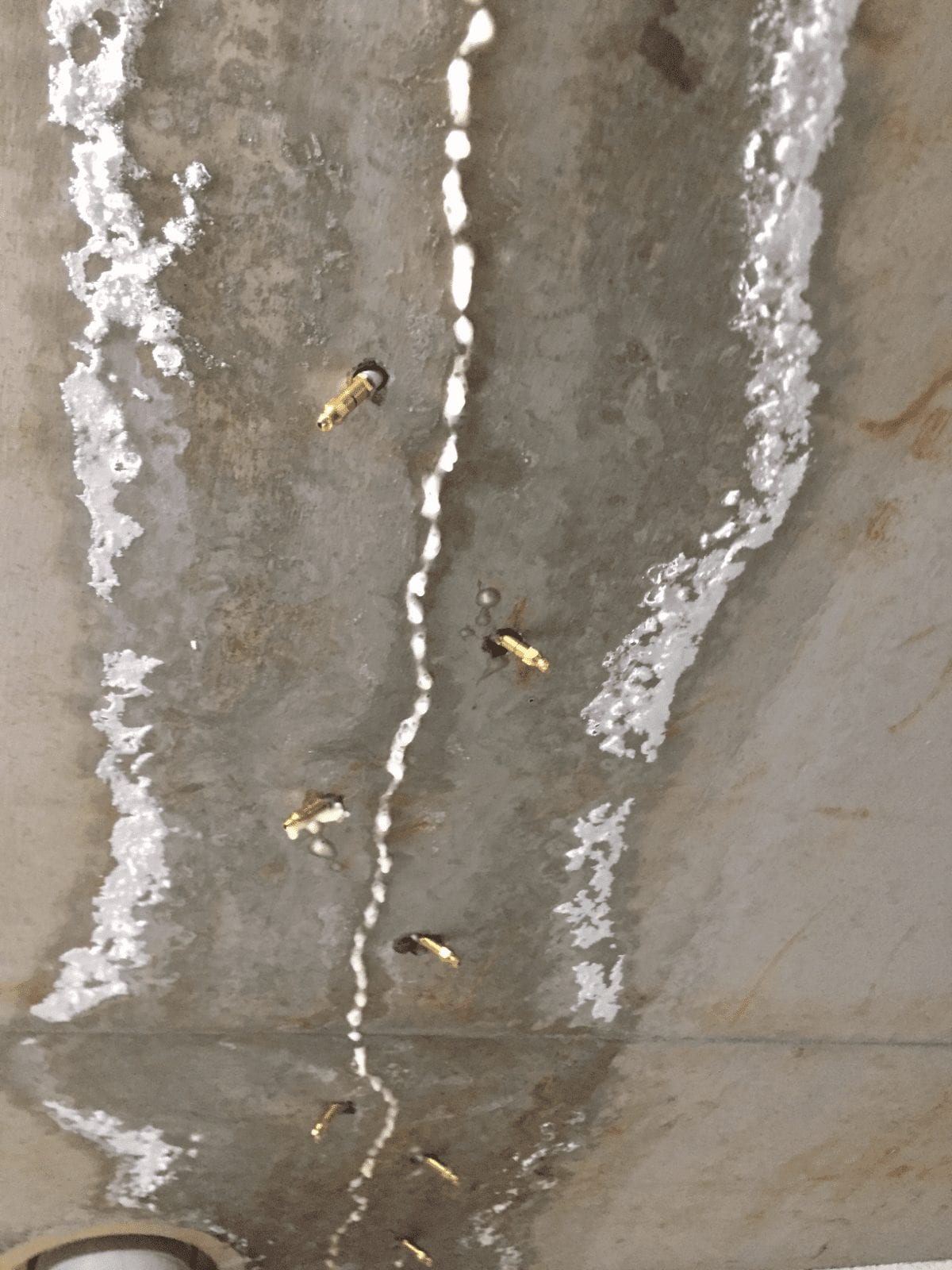Overhead leak sealing - crack injection in concrete slab