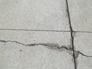 Crack formed outside control joints.