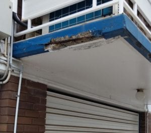 Concrete cancer on balcony edge before works - Waterstop Solutions