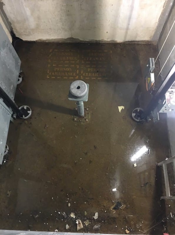 Lift pit full of stagnate water - Before remedial leak sealing injection and waterproof membrane - Waterstop Solutions