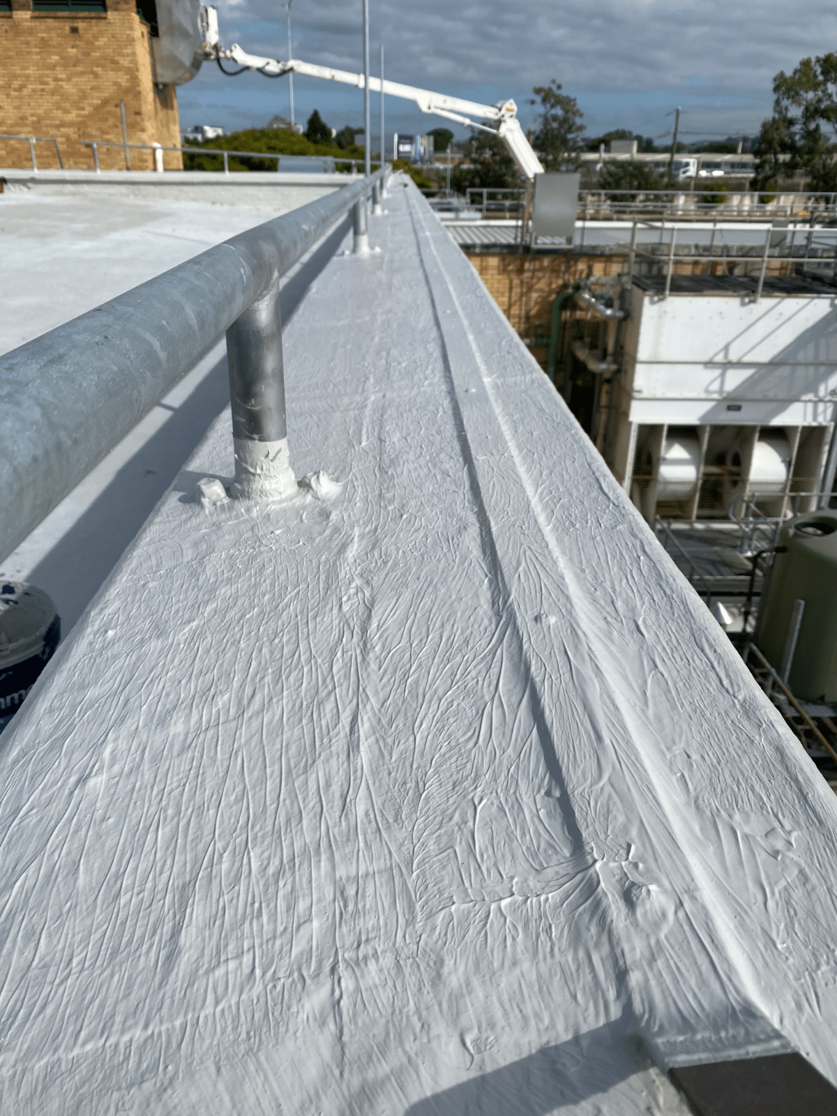 Rooftop membrane repair on parapet wall by Waterstop Solutions