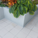 Joint sealant insalled along planter. PWR applied to grout lines - Waterstop Solutions