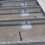 Downer - Leak sealing concrete roof on high voltage building.