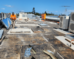 removal of torch on membrane on college rooftop